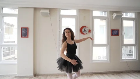 Ballerina doing practice and stretching movements in studio Stock Footage 104695234