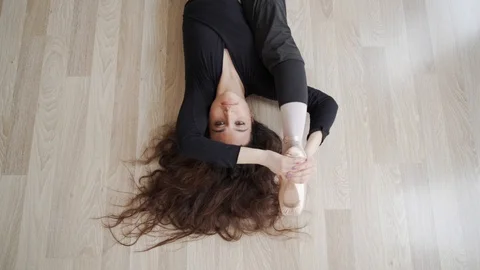 Ballerina doing practice and stretching movements in studio Stock Footage 104698084