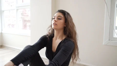 Ballerina doing practice and stretching movements in studio Stock Footage 104700356