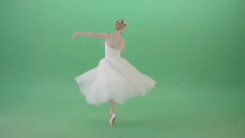 Ballerina in elegant white wedding dress spinning in dance on green screen Stock Footage 144405992
