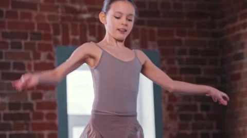 A ballerina girl performing basic dancing in the studio 動画素材 154137440