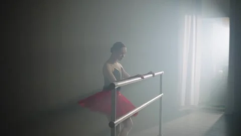 Ballerina improves her technique of performing ballet exercises by barre. Stock Footage 241232681