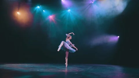 A ballerina performs elements of classical ballet in an empty theater. Stock Footage 205363396