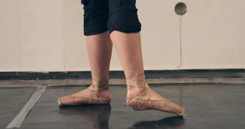 Ballerina practicing on tiptoe at dance hall Stock Footage 142020062