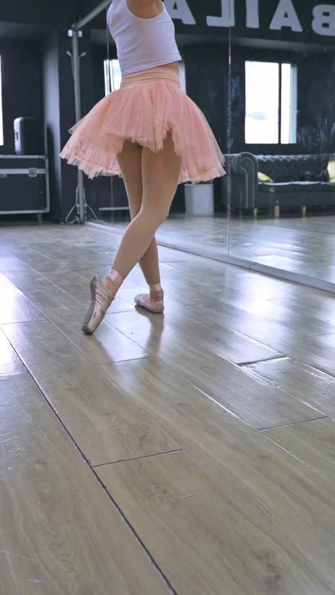 Ballerinas Practicing Pointe Ballet in a Bright Dance Studio. 動画素材 335328032