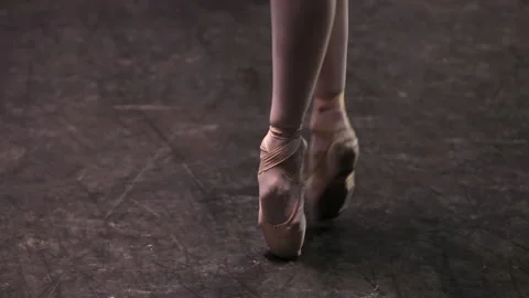 Ballerina’s steps on pointe shoes at the ballet class medium long shot Stock Footage