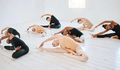 .Ballet, class and group of students stretching on floor together for balance Stock Photos