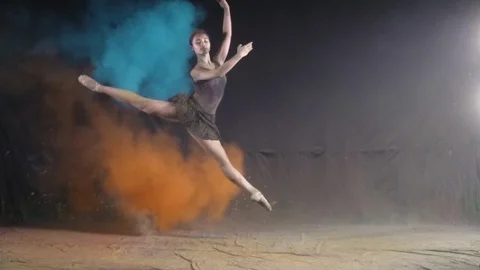 Ballet dance performance with colour powder blast slow motion action clip Stock Footage 93219294