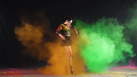 Ballet dance performance with colour powder blast slow motion action clip Stock Footage 93228384