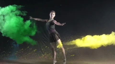 Ballet dance performance with colour powder blast slow motion action clip Stock Footage 93237992