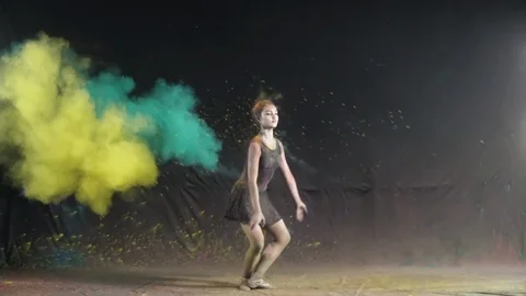 Ballet dance performance with colour powder blast slow motion action clip Stock Footage 93238172