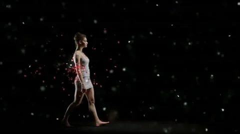 Ballet dancer is dancing alone on stage sorrounded by red petals 動画素材 64524769