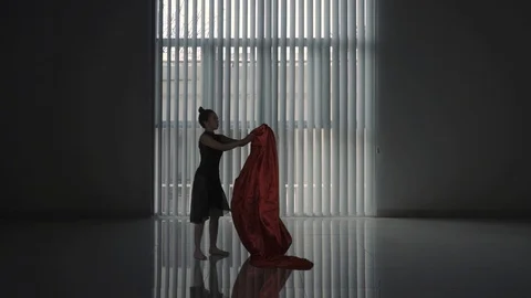 Ballet dancer dancing with a cloth in studio Stock Footage 98070463