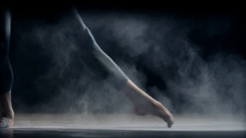 Ballet dancer dancing in powder on stage 스톡 동영상 128916257