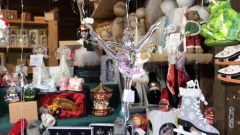 Ballet dancer decoration hanging by thread at Christmas fair Stock Footage 98976628