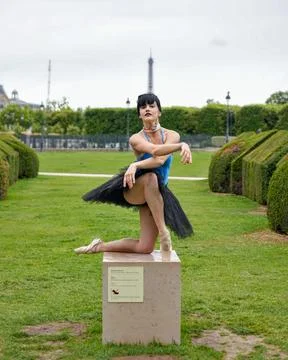 Ballet dancer in elegant pose with Eiffel Tower view Stock Photos