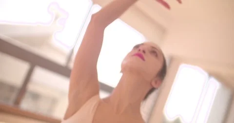 Ballet dancer gracefully dancing with her arms in the air Stock Footage 80273483