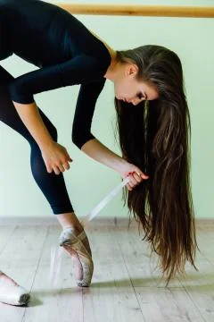 Ballet Dancer Lacing Up Stock Photos