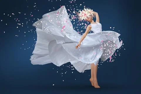 A ballet dancer leaping with grace, adorned in a long white dress and a del.. Stock Photos