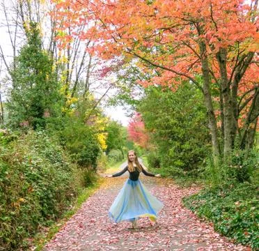 Ballet dancer on pointe with fall leaves Stock Photos