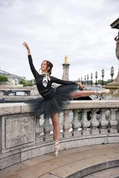 Ballet dancer posing on Paris bridge Stock Photos