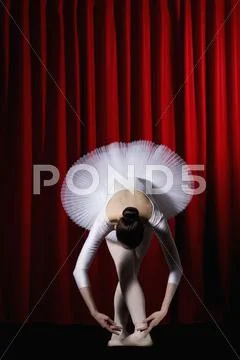 A Ballet Dancer Posing On Stage