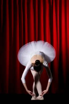 A ballet dancer posing on stage Stock Photos