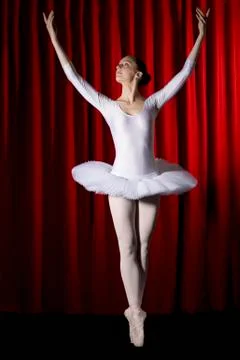 A ballet dancer posing on stage Stock Photos