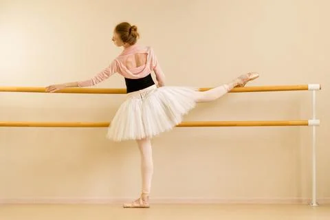 Ballet dancer practicing leg stretch Stock Photos