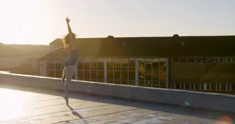 Ballet dancer practicing on rooftop Stock Footage 123925574