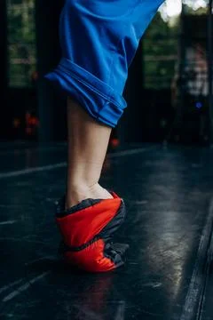 Ballet Dancer Practicing in Warm-up Booties on Stage Stock Photos