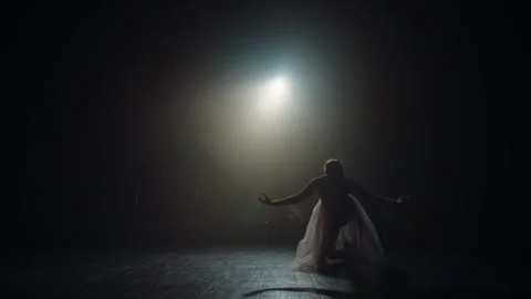 Ballet dancer reverence after performance. Silhouette of young ballerina on Stock Footage 256591286