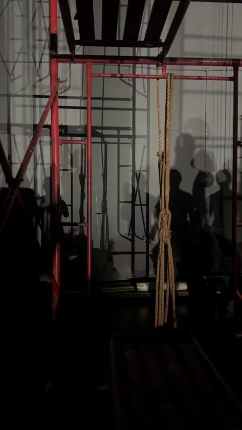Ballet Dancer Shadows Behind Red Scaffolding and Rope Backstage Видео 346384396