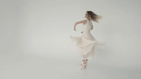 The ballet dancer is spinning and jumping high in the twine. A young ballerina Stock Footage 90131563