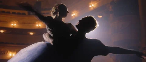 Ballet dancers perform ballet movements on theater stage Stock Footage 238020192