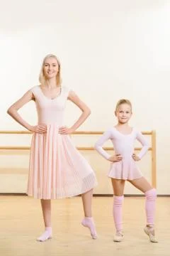 Ballet teacher and her apprentice are busy dancing Stock Photos