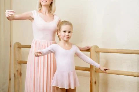 Ballet teacher and her apprentice are holding a pose Stock Photos