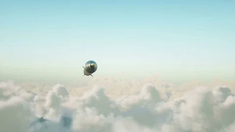 Ballistic nuclear rocket flying over clouds. War and military concept. Realistic Stock Footage 76077733