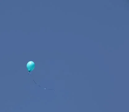 A balloon on a blue sky background Stock Photos