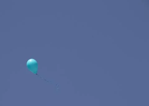A balloon on a blue sky background Stock Photos