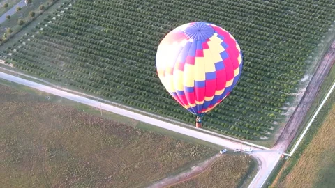 Balloon colored with green background see from a plateau Stock Footage 173279648