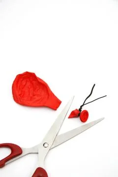 Balloon cut by scissors Stock Photos