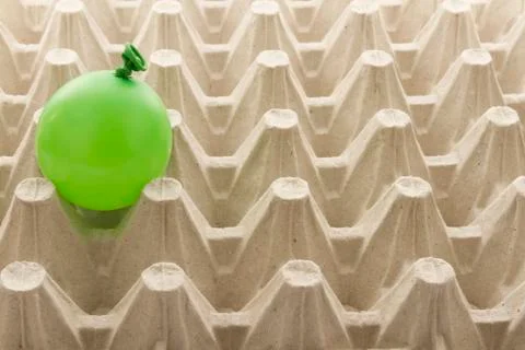 Balloon in egg container Stock Photos