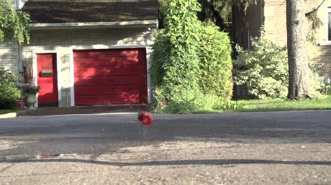 Balloon Fails to Explode on Road (Slow Motion) Stock-Footage 26251112