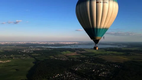 The balloon flies high above the ground, in sunny weather shooting from a drone Stock Footage 205720384