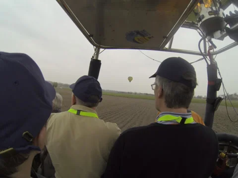 Balloon flight with 99 other balloons over misty land 스톡 동영상 36784104