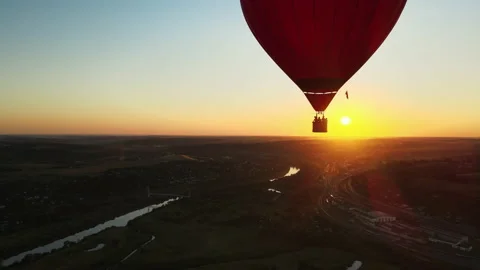 Balloon flight over the city and river at sunset Stock Footage 167396236