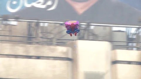 Balloon flying in sky over Cairo crowd of Muslims praying Video stock 82319828