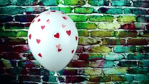 Balloon with hearts and bricks background Stock Footage 84718482