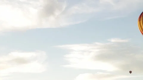 Balloon long pan left right beautiful blue sky hot air balloons travel adventure Stock Footage 35403248